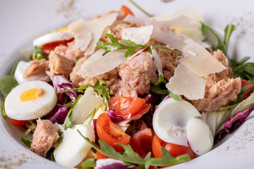 close up of fresh tasty tuna salad with eggs