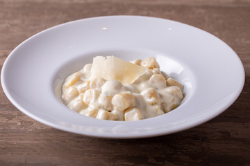 Fototapeta na wymiar details of fresh hot gnocchi with 4 cheese cream