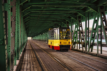 City tram on bridge at day in Warsaw, Poland