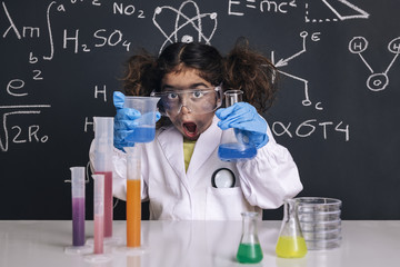 surprised scientist girl with gloves in lab coat - obrazy, fototapety, plakaty