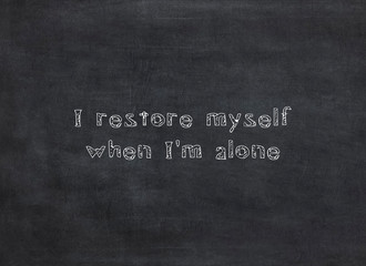 I restore myself when I'm alone written on a blackboard