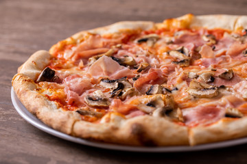 details of tasty ham and mushrooms pizza