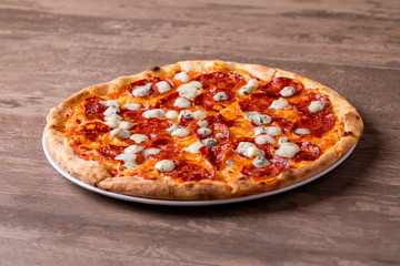 delicious details of salami and gorgonzola pizza