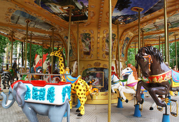 Fototapeta na wymiar Children's carousel in an amusement park, an amusement park.
