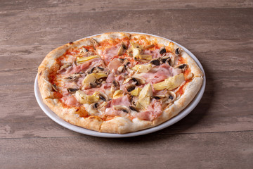 details of fresh baked tasty italian capriciosa pizza