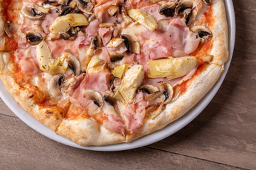 details of fresh baked tasty italian capriciosa pizza