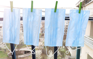 Washed disposable face masks are dried out. Prevention from Covid-19 or coronavirus