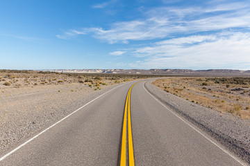 Asphalt road in the desert.  Road 3 (Ruta 3) through the Argentinean pampa - Santa Cruz province