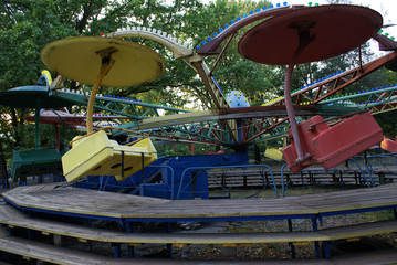 Fototapeta na wymiar Children's carousel in an amusement park, an amusement park.