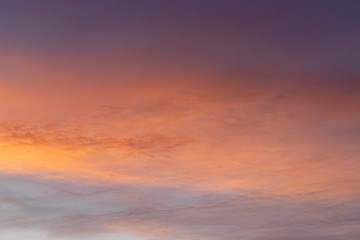 Beautiful dramatic sunset orange, blue, purple sky with clouds background