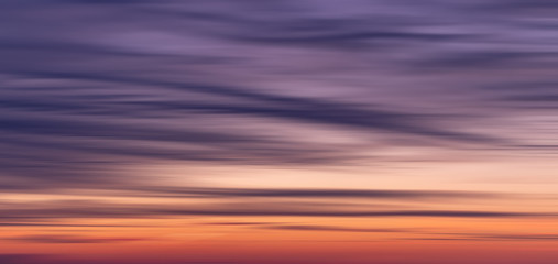 Wide beautiful blurred sunset orange, blue, purple gradient background