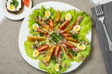 Nicoise salad with cod liver. View from above.