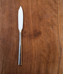 fork and knife on wooden background