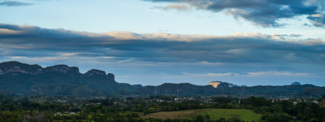 Naklejka na ściany i meble panorama landscape with mountains and valley at sunset in vinales, cuba