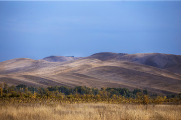 Landscape Steppe hills in autumn at sunset