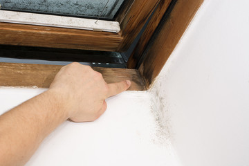 dark traces of moisture on the window pane, caused by insufficient ventilation, bad thermal insulation