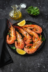 Vertical shot of a plate with red big prawns