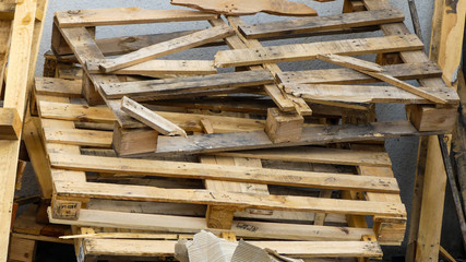 Broken stacked pallets after use