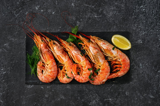 Top view of red huge prawns on black background