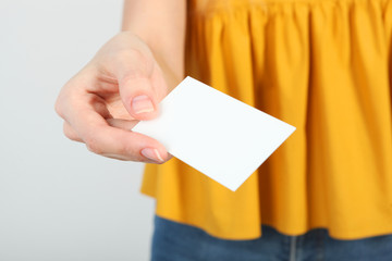 Business card in a female hand