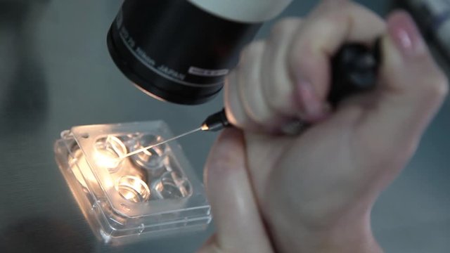 AIDS. HIV. sexually transmitted diseases. a blood test. semen.in the laboratory closeup of glass containers  under a microscope. pregnancy test. anthrax. bird flu. swine flu.