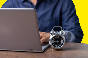 Male employee reading data from computer while working from home or WFH To prevent contact from the Corona virus, Covid-19.