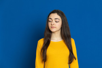 Brunette young girl wearing yellow jersey