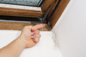 traces of moisture on the finger, taken from the window pane, bad ventilation and thermal insulation