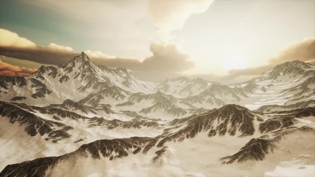 rays of sunset on the tops of the mountains on a sunny day