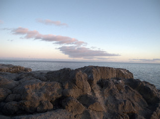 Sunset over calm Caribbean waters in Rock Sound, Eleuthera.
