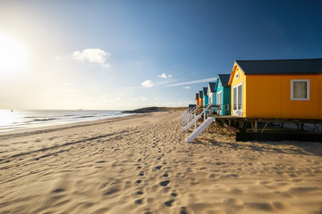 small colorful buildings on sea beach - 334523787