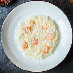 risotto shrimp prawn seafood rice Menu concept. food background. top view copy space for text keto or paleo diets