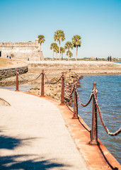  Sea Wall Walkway with Spanish Fort and Palm Trees in Background