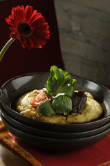 Brasato of Rump in red wine and radishes Vinaigrette with cress on creamy polenta ..