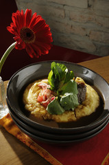 Brasato of Rump in red wine and radishes Vinaigrette with cress on creamy polenta ..
