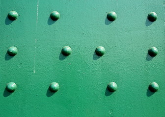 A beautiful old green bridge with steel structures.
