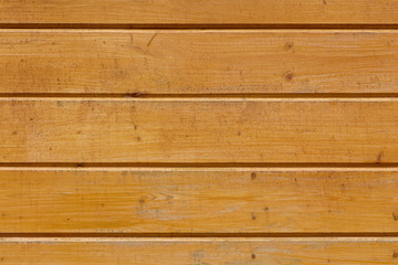 Naklejka premium Yellow background from lining boards, horizontal arrangement.