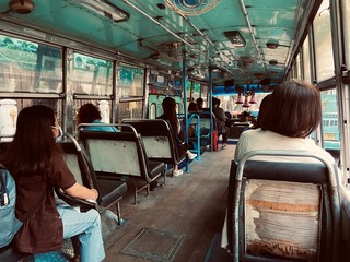 Obraz na płótnie Canvas Bangkok, Dusit / Thailand - March 16, 2020: The daily way of life of the crowd is returning home during the completion of work by old condition bus number 108 in the evening.