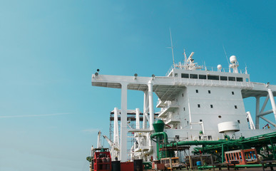 Accommodation deck with mast antenna radio and navigation bridge deck of oil tanker ship moored...