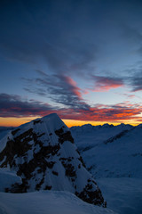 Colorful winter sunset on the top of Mons Avium Peak in Switzerland.