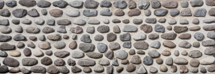 Pebble stone wall texture background.