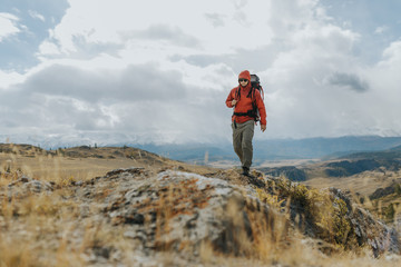  Man Traveler with Backpack hiking in the Mountains  Activity scene. Wanderlust photo series