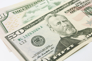 Fifty dollar bills in cash on white background