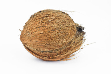Photo of a rustic coconut in the middle of an isolated white background