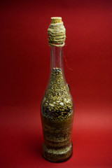 Bottle filled with different cereals