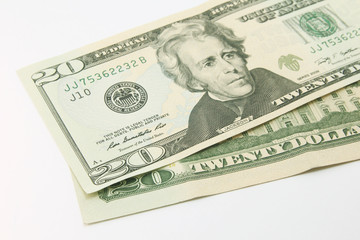 Twenty dollar bills in cash on white background