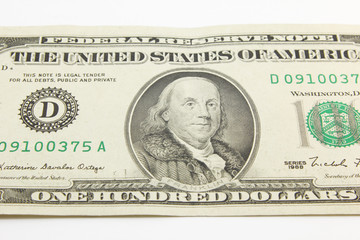 One hundred dollar cash banknotes on white background
