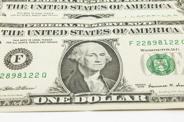 One dollar cash bills on white background