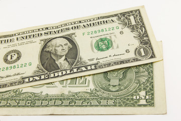 One dollar cash bills on white background