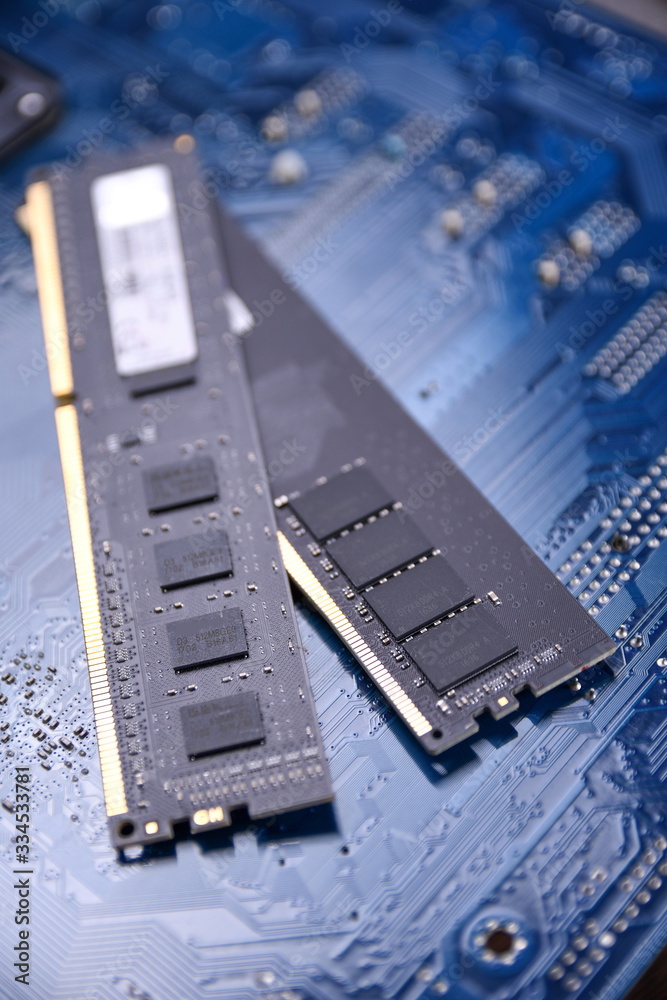 Poster computer memory ram on motherboard background . close up. system, main memory, random access memory,